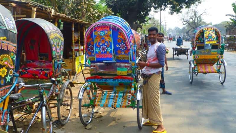 CHITTAGONG, BD - Feb 21, 2017: Busy and chaotic street in Chittagong,Bangladesh full of colourful rickshaws transporting people and any loads which is the main transport.