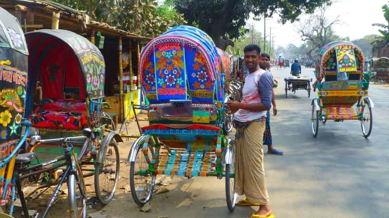 CHITTAGONG, BD - Feb 21, 2017: Busy and chaotic street in Chittagong,Bangladesh full of colourful rickshaws transporting people and any loads which is the main transport.