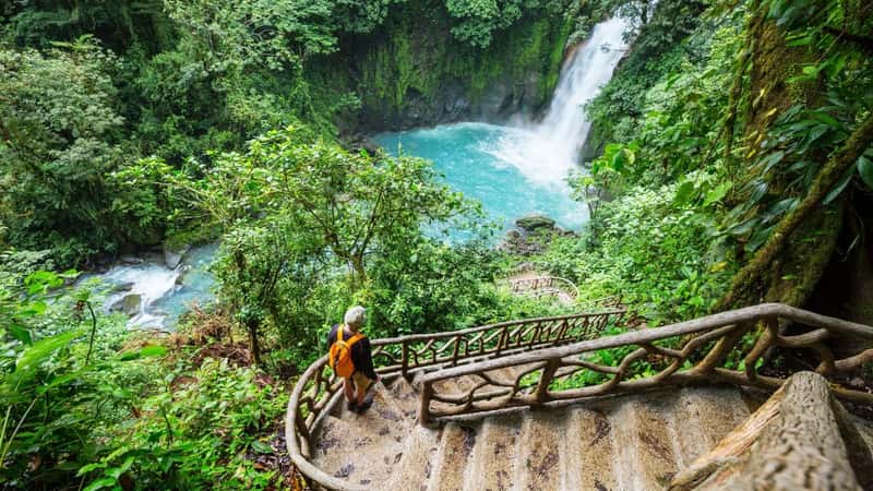 Majestic waterfall in the rainforest jungle of Costa Rica. Tropical hike.