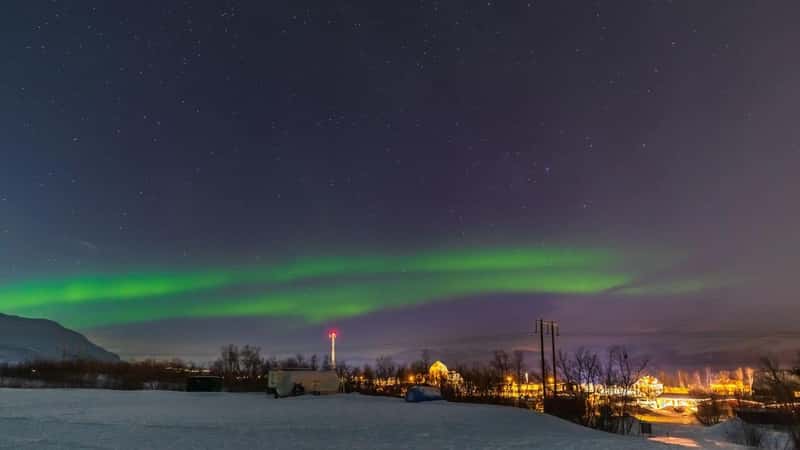Northern light over the town of Abisko. Abisko National Park. Lapland, northern part of Sweden.