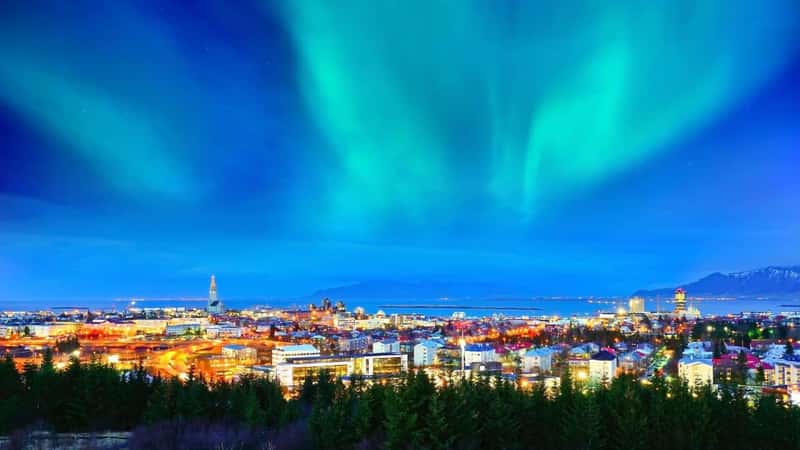View of the northern light from the city center in Reykjavik, Iceland.