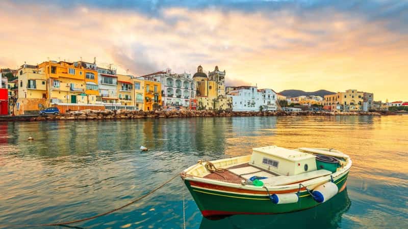 Ischia Island, Naples, Italy on the Mediterranean coast at sunset.