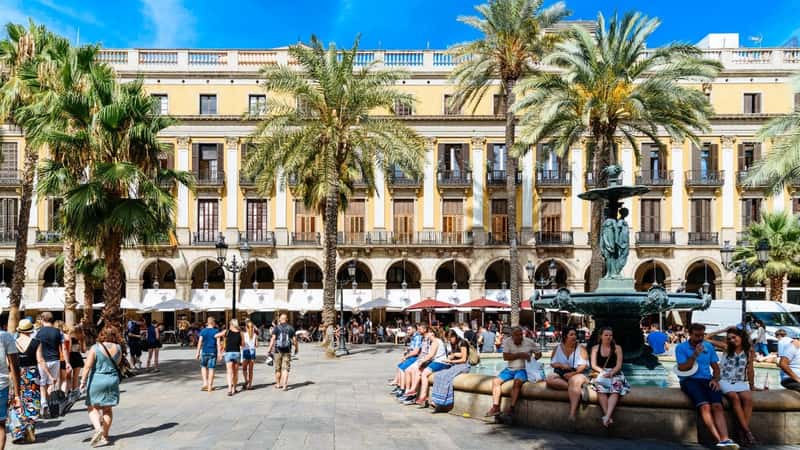 BARCELONA, SPAIN - AUGUST 05, 2016: People Gathering In Royal Square (Placa Reial or Plaza Real) a Well-Known Tourist Attraction Of Barcelona