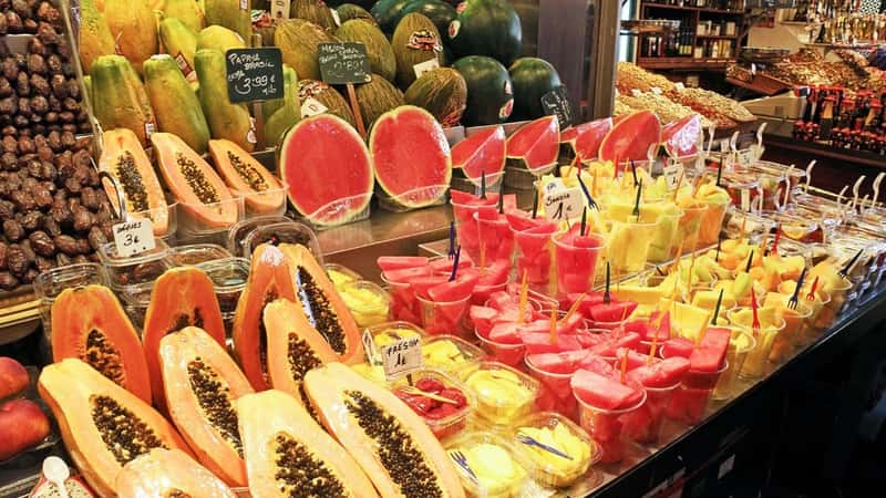 Barcelona, Spain - August 14 2012: Fruit Stand in la Boqueria Market in Barcelona, Spain with Watermelon and Papaya