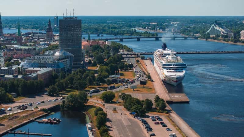 Huge cruise - Norwegian Dawn - ship docked in the center of Riga, Latvia. Aerial view of Riga city.