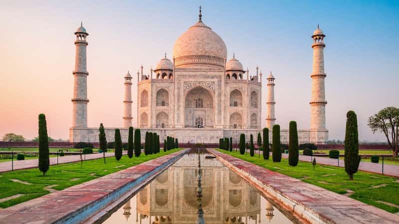 Taj Mahal is a white marble mausoleum on the bank of the Yamuna river in Agra city, Uttar Pradesh state, India