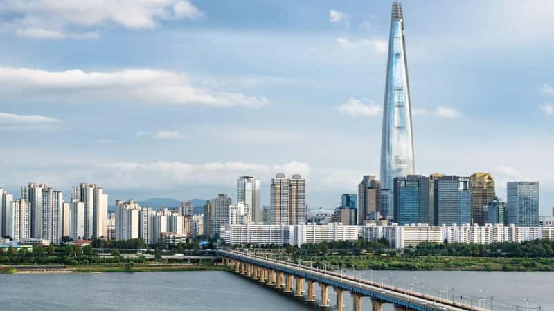 Awesome view of skyscraper and Jamsil Railway Bridge over the Han River (Hangang) in Seoul, South Korea. Amazing cityscape. Seoul is a popular tourist destination of Asia.