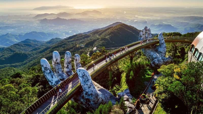 Tourist walking at Golden bridge in Bana hills, Da nang, Vietnam.