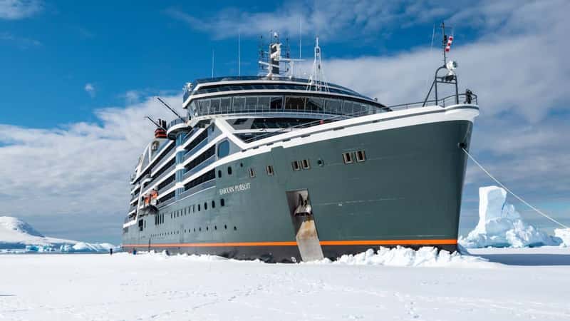Hanusse Bay, Antarctica - January 14, 2024: Cruise ship Seabourn Pursuit breaking through sea ice in Antarctica.