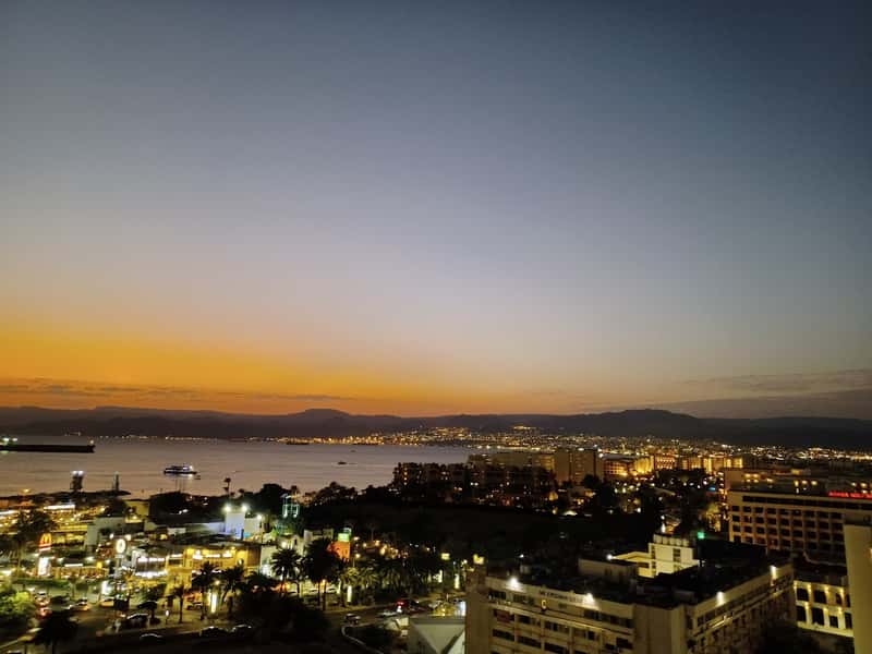 sunset over aqaba and the gulf of aqaba looking towards israel and egypt.