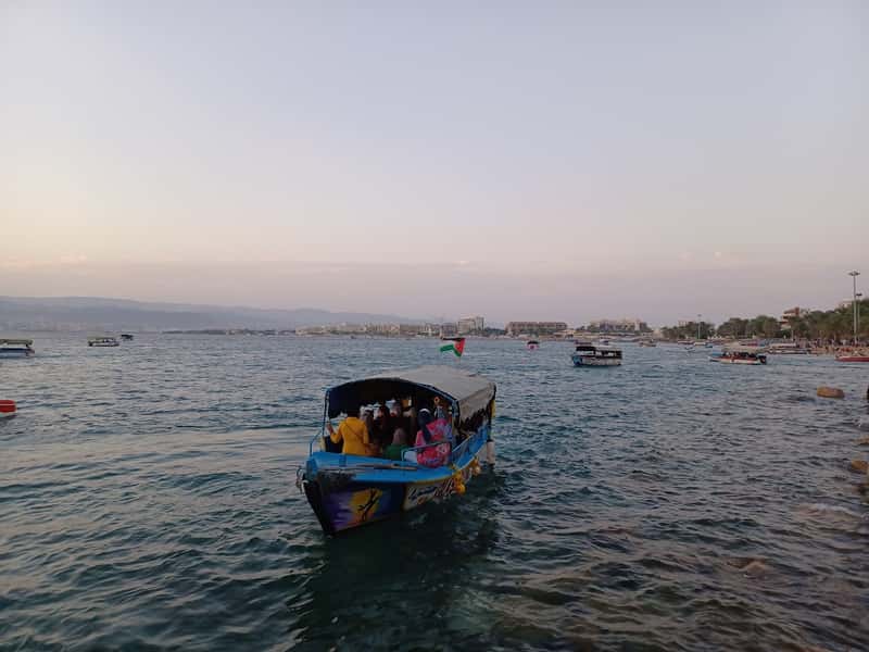a glass bottom boat sails on the gulf of aqaba jordan