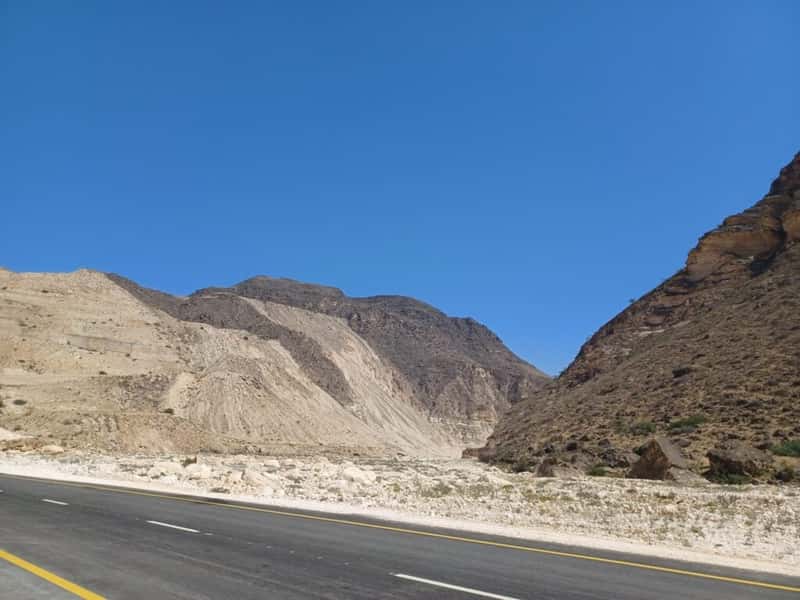 a road through a mountain pass in southern oman