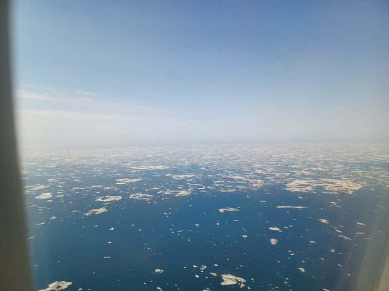 view of icebergs on the arctic ocean on an alaskan airlines flight landing in Utqiagvik alaska united states
