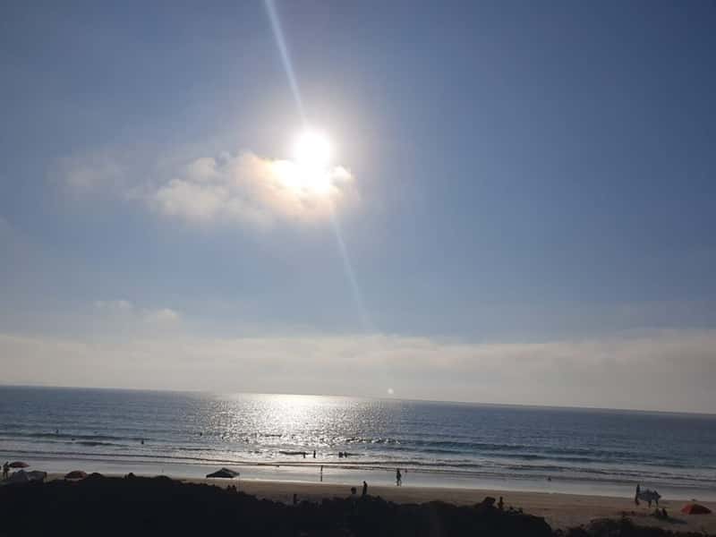 the sun over the pacific ocean on tijuana beach mexico