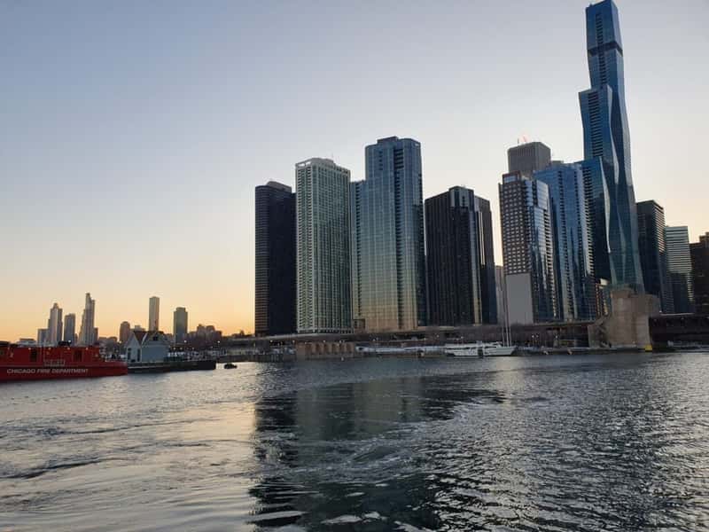sunset over the chicago skyline in illinois usa from lake michigan