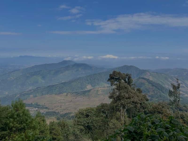 View of surrounding mountains as I hiked down the volcano