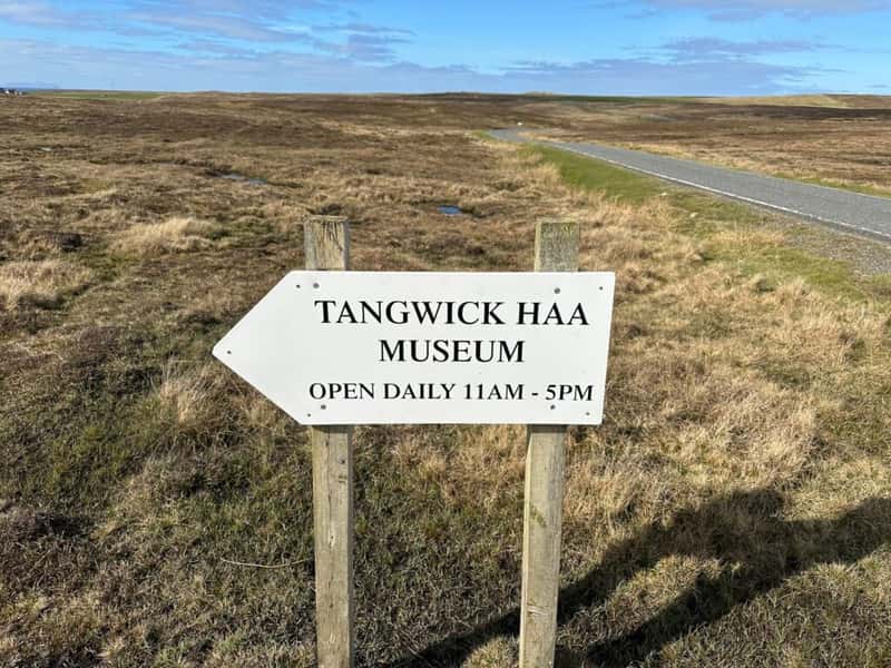 a wooden signpost pointing to tangwick haa a former laird's house museum in northmavine shetland scotland