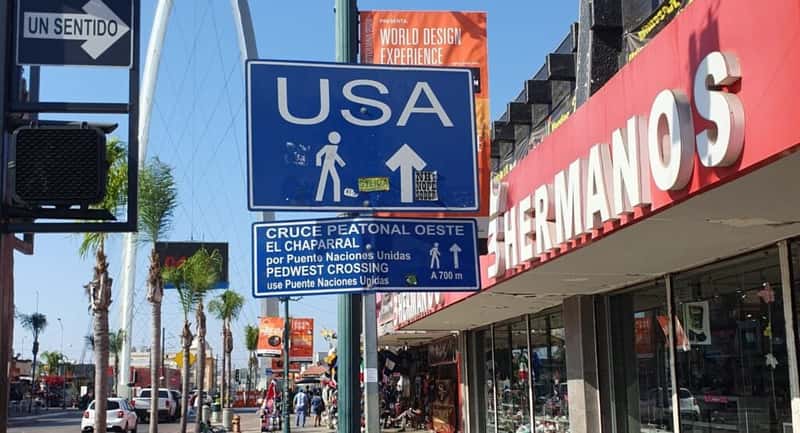 sign pointing towards the USA on avenida revolucion tijuana mexico