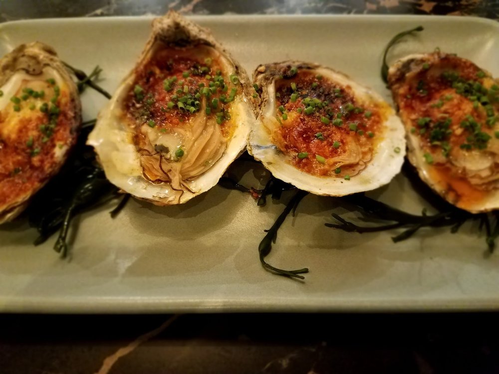 Roasted oysters at Proxi .