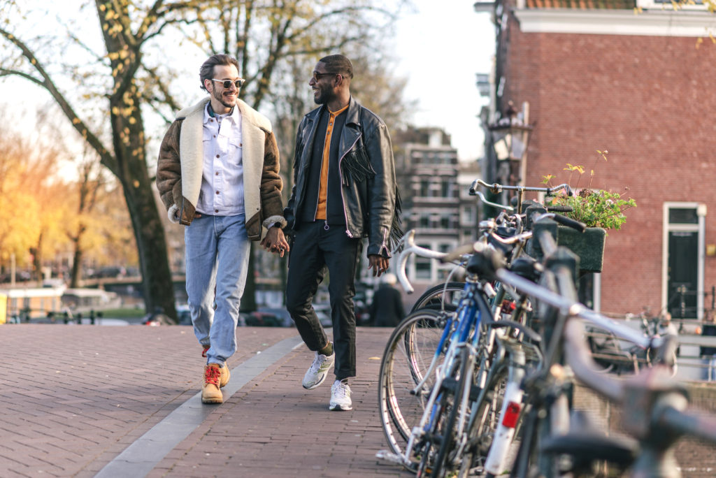 Millennial gay couple on city break