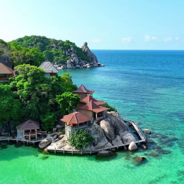 Nestled in the Gulf of Thailand, Koh Tao beckons with its pristine beaches and thriving marine biodiversity. Discover a haven for diving enthusiasts and nature lovers alike. Bird's eye view.
