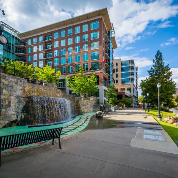 Modern buildings and walkway along the Reedy River, in downtown Greenville, South Carolina.